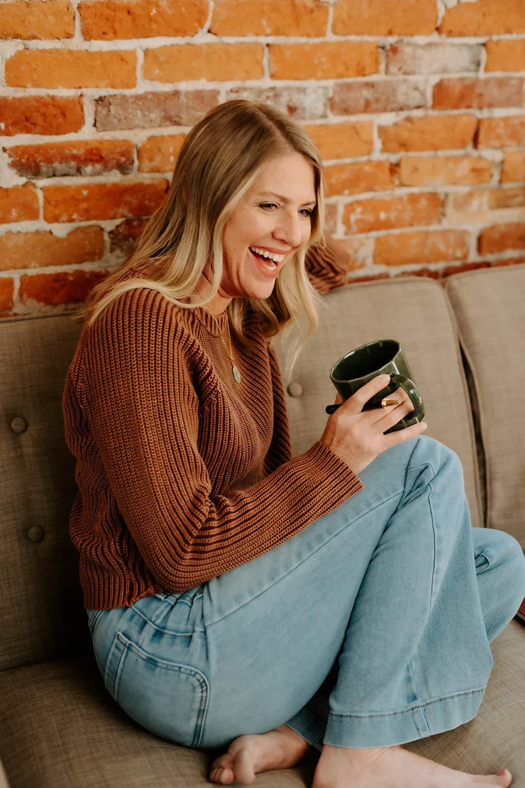 Julie Holly laughing over coffee