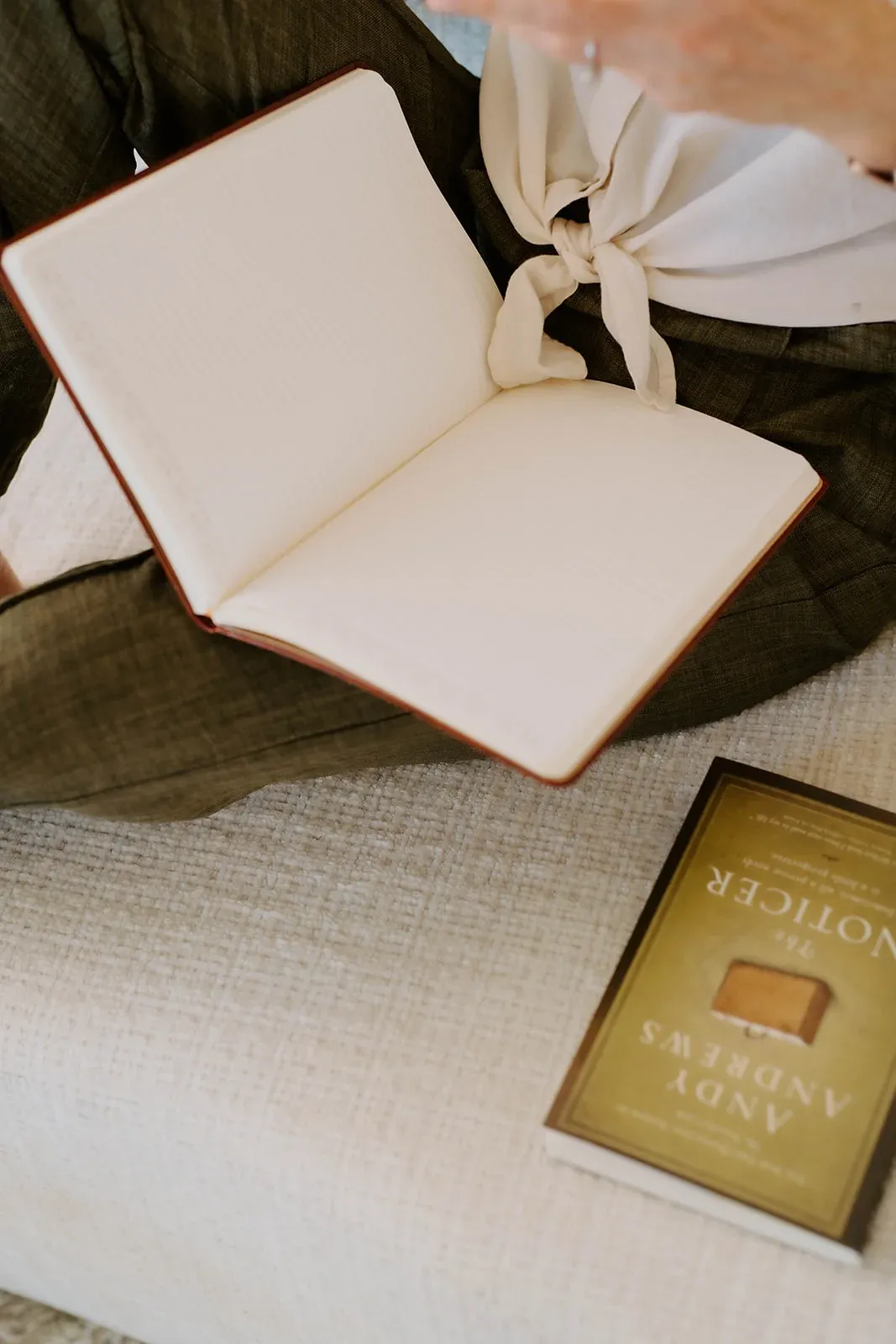 An open notebook beside a seat